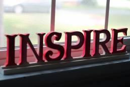 red letters spelling inspire for inspirational leadership