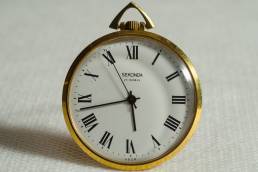 Improve your time management. Gold edged clock with white face