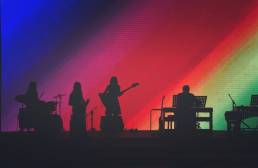 Jo Murfin Career Coach Brighton, image of a band in shadow against rainbow background