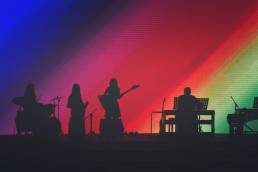Jo Murfin Career Coach Brighton, image of a band in shadow against rainbow background